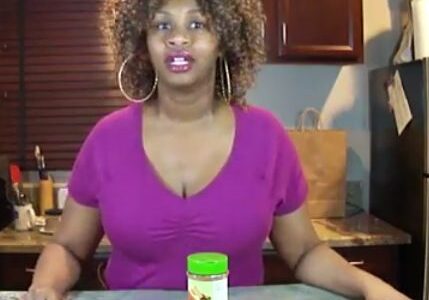 Woman in kitchen with cinnamon challenge setup