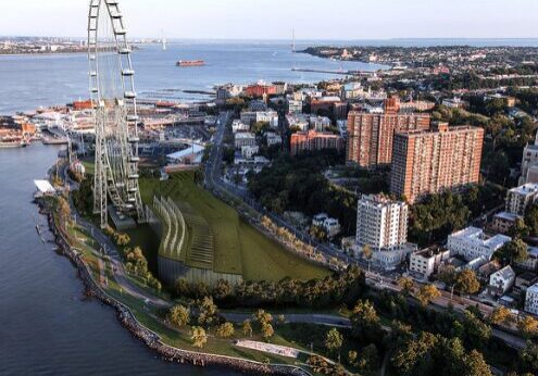 Waterfront cityscape with ferris wheel