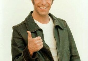 Man in leather jacket giving thumbs up