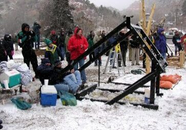 People watching outdoor event in snowy weather