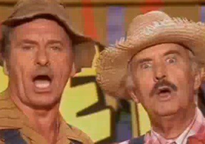 Comedic duo in colorful background reaction