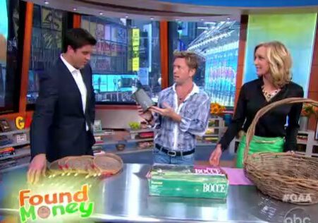 Hosts examining vintage items on show