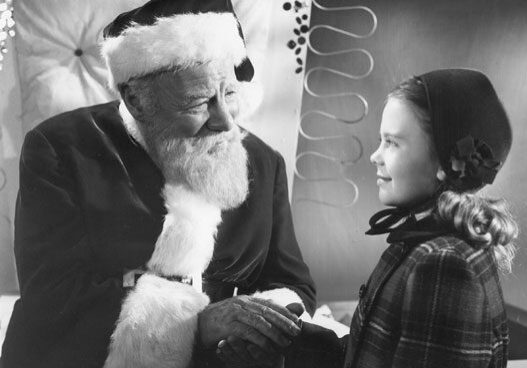 Santa and girl sharing a moment