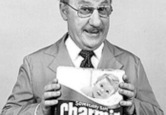 Smiling man with Charmin product