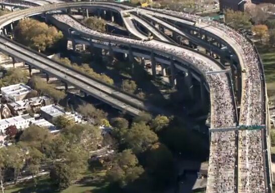 Aerial view of marathon runners on highway