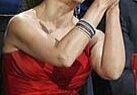 Woman in red dress clapping