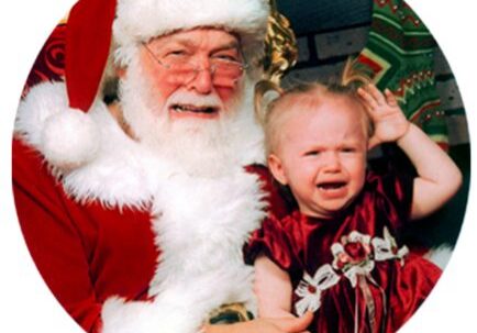 Santa with crying toddler on lap