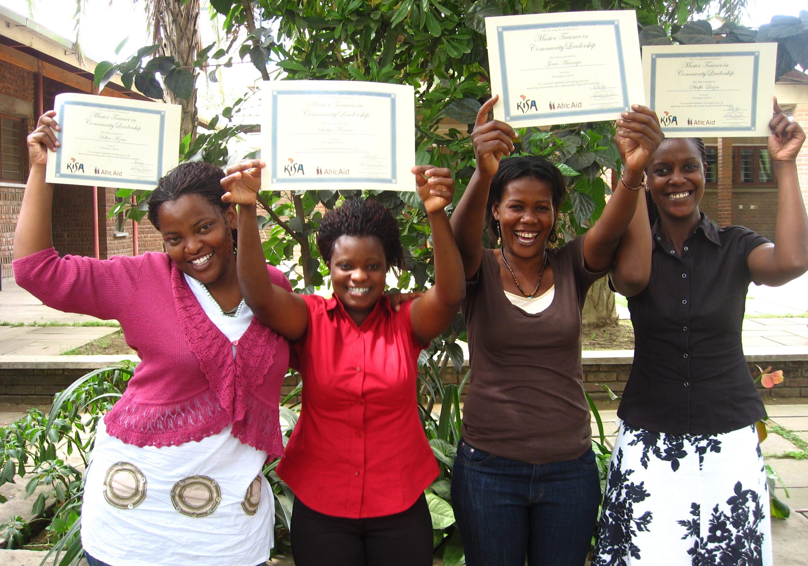 Group of women holding certificates proudly