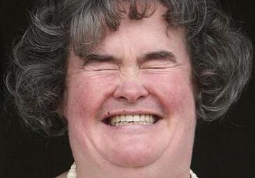 Woman laughing with closed eyes