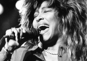 Singer performing passionately on stage