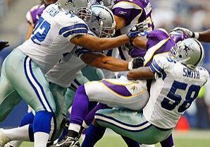 Football players in action on the field.