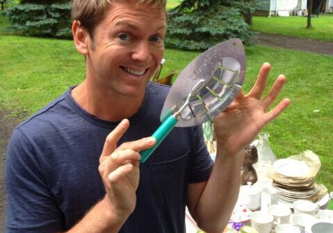 Smiling man with garden tool