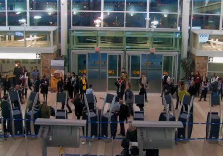 Busy airport terminal entrance