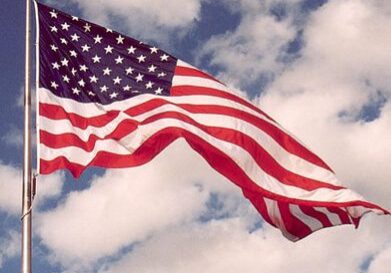Stars and stripes with clouds background