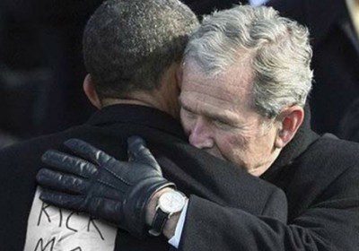 Two men hugging with prank note