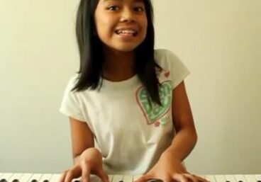 Young musician at keyboard