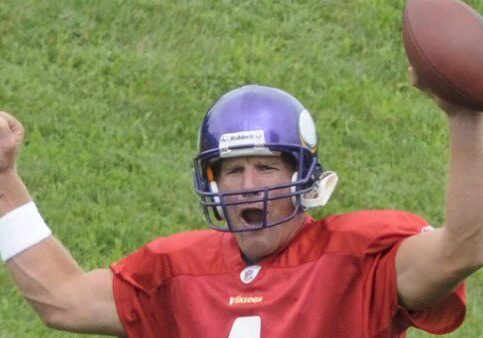Football player celebrating with raised arms