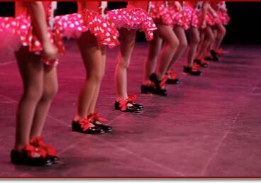 Tap dancers in matching outfits