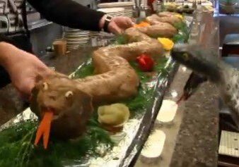 Realistic snake cake being served