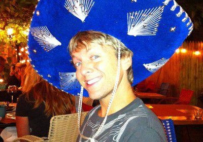 Man wearing a large blue sombrero