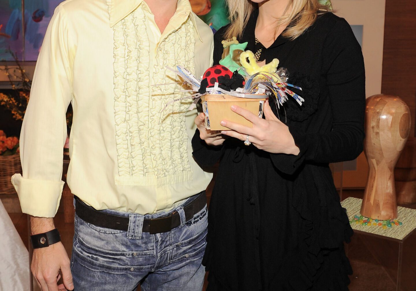 Man wearing bunny ears and woman holding basket