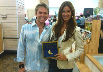 Happy pair with a children's book