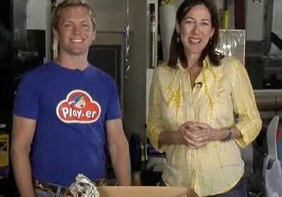 Smiling pair with a cardboard box