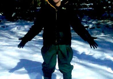 Person standing in snowy forest
