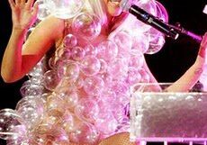 Singer in bubble outfit performing on stage