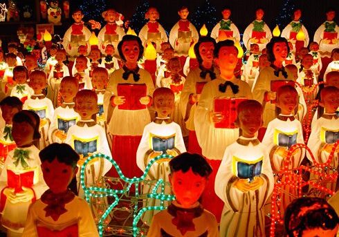Festive choir dolls holding books