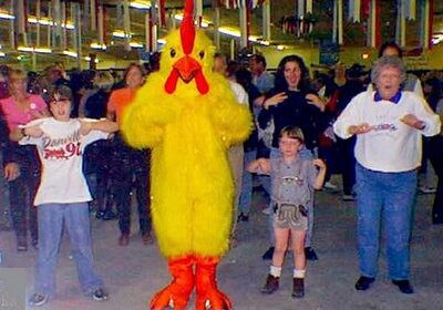 Group dance with chicken mascot