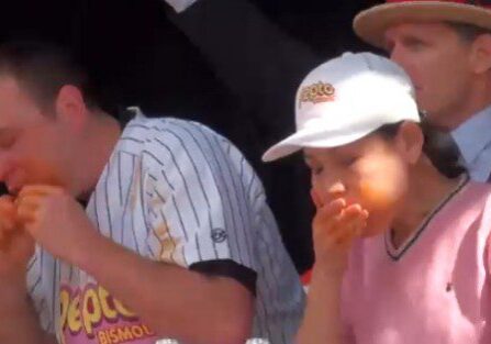 Competitive eaters in action at event