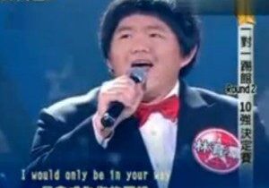 Singer performing on stage with microphone