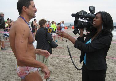 Beach interview with camera crew