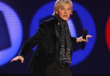 Person in black jacket holding microphone