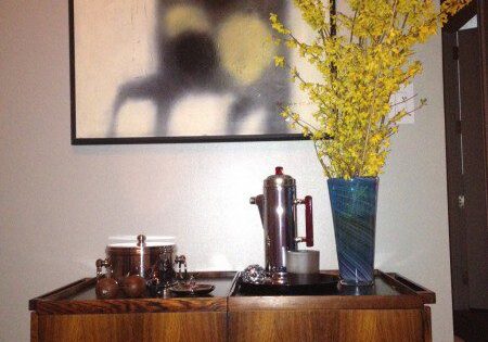 Wooden cabinet with art and flowers