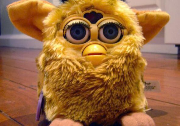 Yellow furry toy with big eyes
