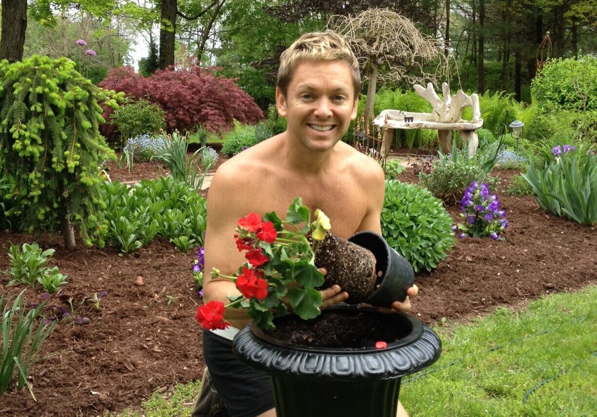 Person arranging plants outdoors