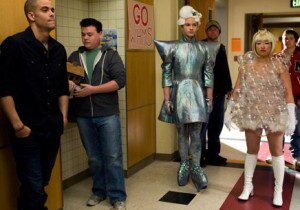 Group dressed in futuristic outfits indoors