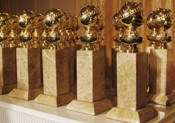 Multiple golden statuettes on pedestals