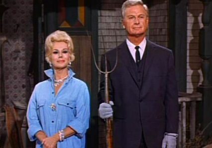 Woman in blue shirt, man in suit