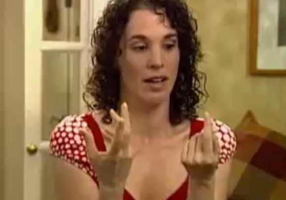 Woman displaying hands in interview