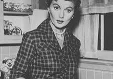 Retro housewife in kitchen