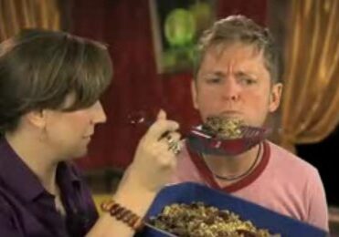 Man hesitates to eat strange meal.