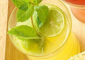 Citrus drink garnished with mint