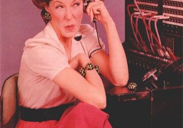 Woman at vintage telephone switchboard