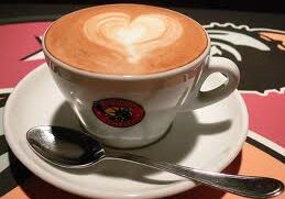 Coffee cup with heart-shaped foam art