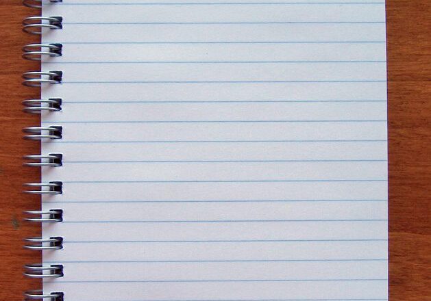 Blank notebook on wooden table