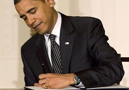 Person in a suit with a pen