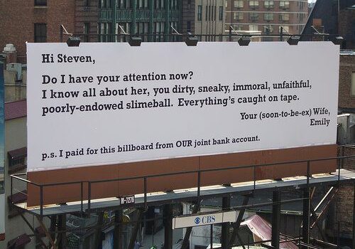 Public breakup message on urban billboard